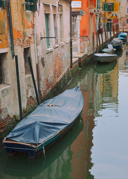 Boats tied up in a side canal